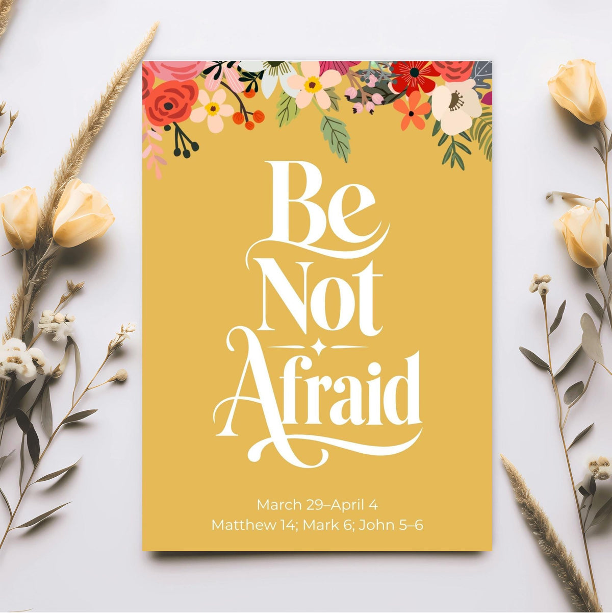 Golden yellow Be Not Afraid Bible verse poster with large white decorative lettering and bright orange pink floral accents