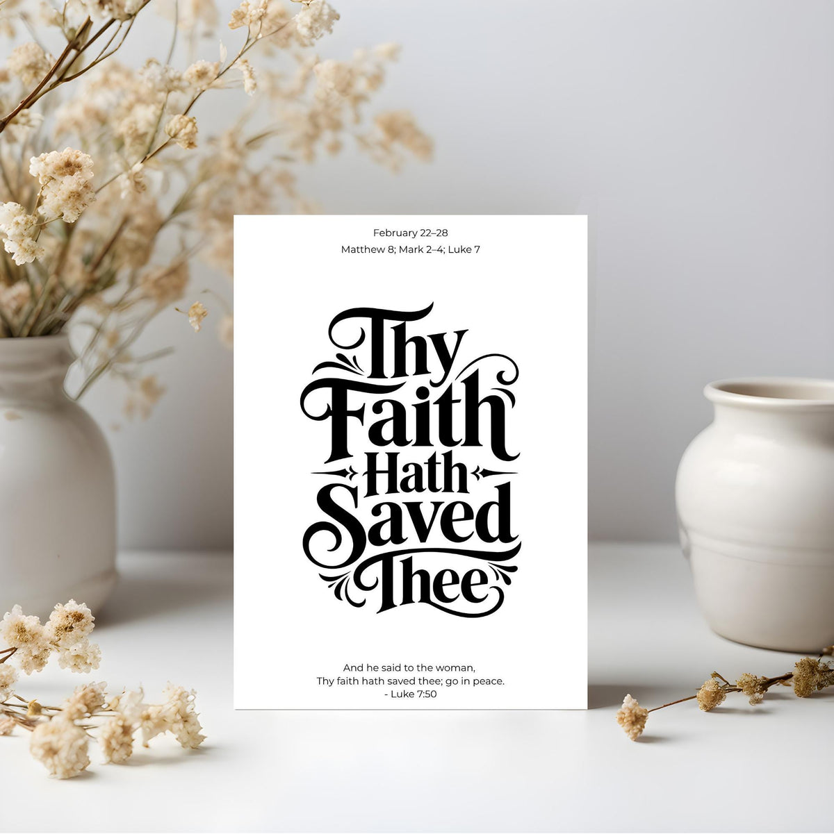 Thy Faith Hath Saved Thee Bible verse typography artwork framed beside dried flowers